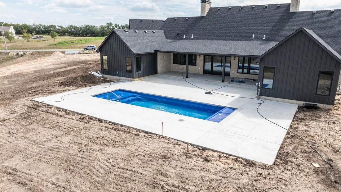 A backyard made for gathering by Guardian Poolscapes